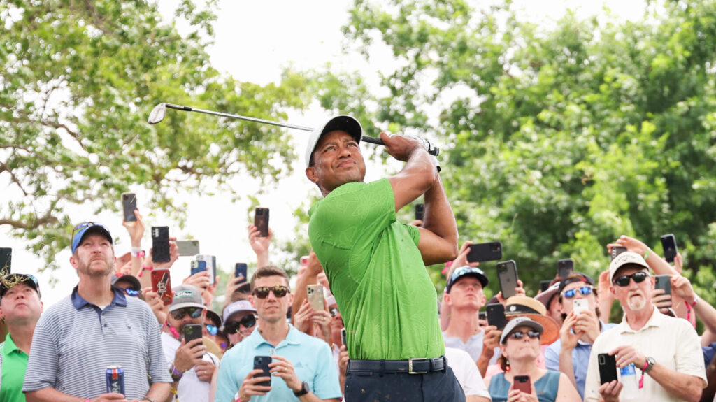 Woods completes 16 holes in first public round since last November 14