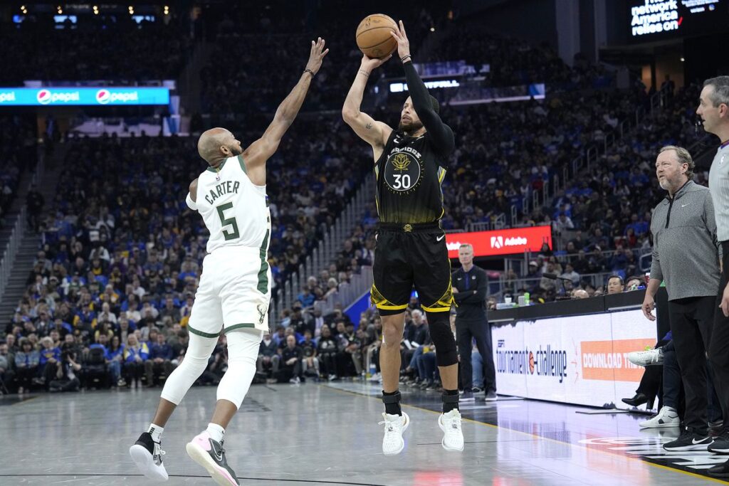 Curry and Warriors humble flying Bucks 125-116 in OT