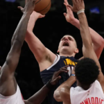 Jokic leads Nuggets to 108-102 win over Nets