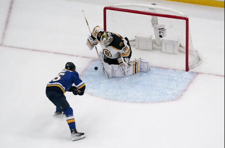 Bruins reach win number 60 after Blues shootout