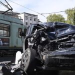 Immobile hospitalized after car crash