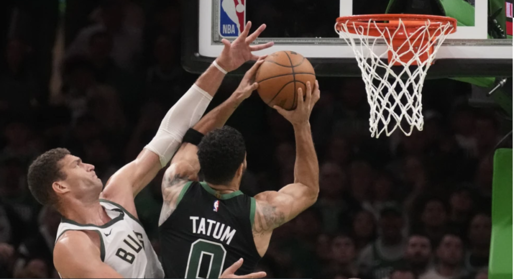 Tatum scores 23 points, carrying Celtics to 119-116 win over Bucks