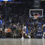 Curry’s 36 points push Warriors to 121-115 win over Magic