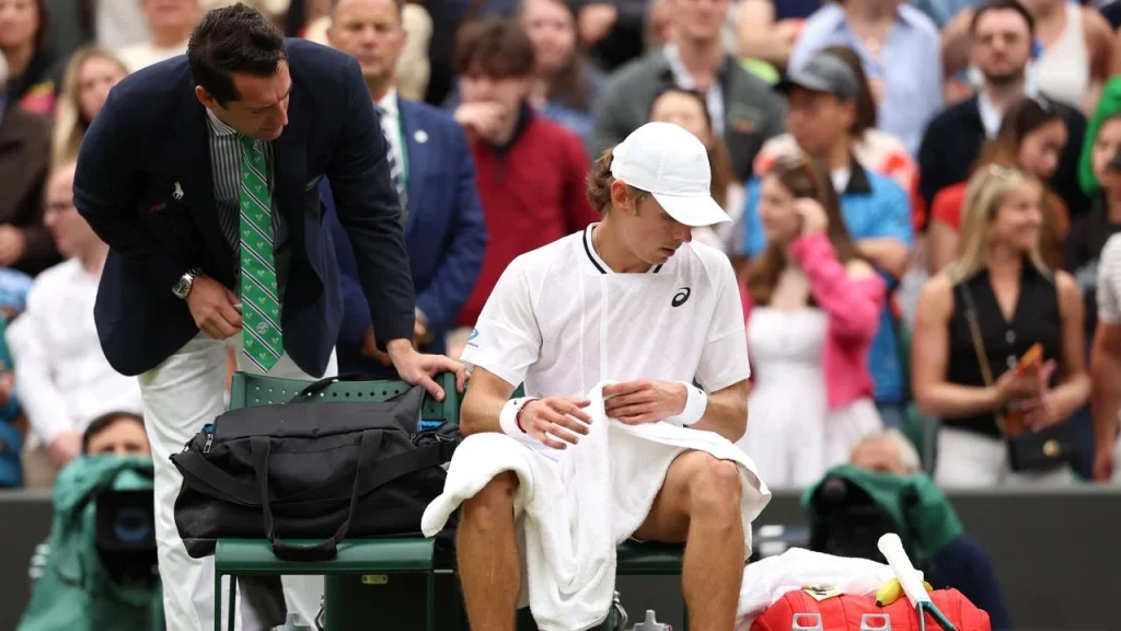 Djokovic through to Wimbledon semis after De Minaur retirement